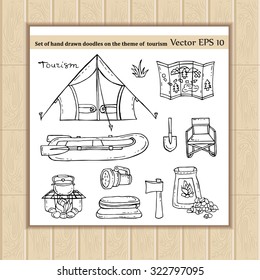 Vector set of hand drawn doodles on the theme of tourism. Symbols of tourism - tent, boat, fire, ax, shovel, map, flashlight, sleeping bag. Sketches for use in design, packing, textile, fabric