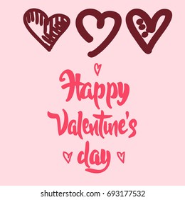 Vector set of hand drawn graphic color hearts and Happy Valentine's Day lettering on background.