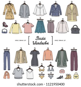 Vector set with hand drawn isolated colored doodles of basic wardrobe. Sketches on the theme of fashion
