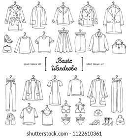 Vector set with hand drawn isolated doodles of basic wardrobe on white background. Fashion sketches
