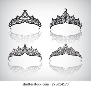 vector set of hand drawn lace beautiful decorated with pattern vintage crowns isolated. May use as logos or icons. Crown silhouettes