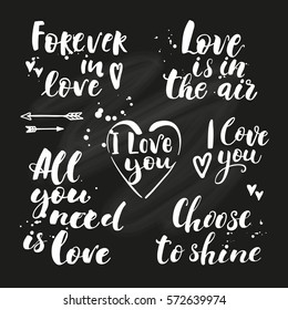 Vector set of hand drawn lettering on chalkboard background. Inspirational quote. Forever in love. Love is in the air. I love you. Decorative hand drawn ink lettering about love.