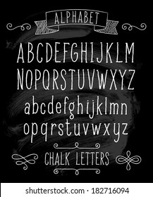 Vector set with hand written ABC letters and typography elements on black background. Chalk design