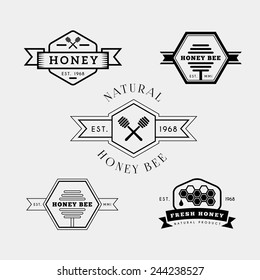 Vector set of honey and bee labels, badges in retro style in black color