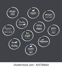 vector set of  icons of Organic, Healthy, Vegan, Vegetarian, Raw, GMO, Gluten free Food, white circle logo symbols on grey background