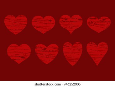 Vector set of isolated grunge red hearts of different shape on a maroon background. Eps 10.