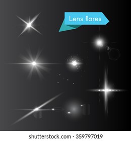 Vector set of lens flares and glowing white flash elements 
