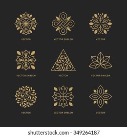 Vector set of logo design templates and emblems in trendy linear style in golden colors on black background - floral and natural cosmetics concepts and alternative medicine symbols