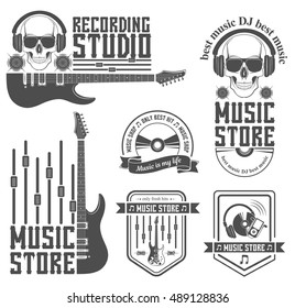 Vector set of logo for the recording studio and music shop. Graphic design concept with a silhouette of a guitar, skull, headphones, equalizer, note. Symbol, emblem, on an element of the music.