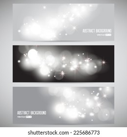 Vector set of modern banners with silver glittering on bokeh.