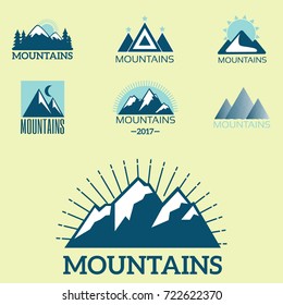 Vector set of mountain exploration vintage emblems and rock silhouette design elements