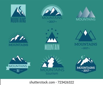 Vector set of mountain exploration vintage emblems and rock silhouette design elements