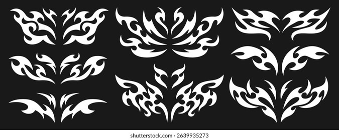 Vector set of neo tribal y2k tattoo. Neotribal dividers, symmetrical abstract shapes or cyber sigilism elements. White celtic gothic body ornaments. Emo butterfly stickers with wings and demon hearts.