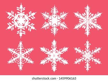 Vector set of paper cut white snowflakes isolated on traditional red background