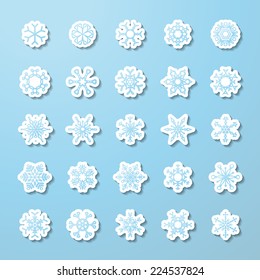 Vector set of paper snowflake stickers. Paper icons on blue background for your winter design.