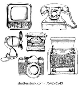 Vector set of retro devices. Sketch style black on white background. Ventilator, camera, phone, tv, typewriter, radio, turntable.