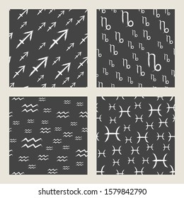 Vector set of seamless patterns with white zodiac signs on black background. Four Horoscope symbols: sagittarius, capricorn, aquarius, pisces.