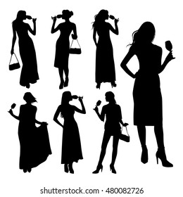 Vector set of silhouette young elegant women dressed in evening dress holding wine glasses with a cocktail in hand. Sexy girl with a glass. 