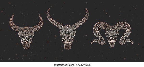 Vector set of skulls bull, buffalo and ram with decorative pattern. Gold image on black textured background. Ornate silhouette.