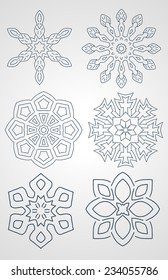 Vector set of snowflakes. Hand-drawn silhouettes of blue snowflakes isolated on a gray background.