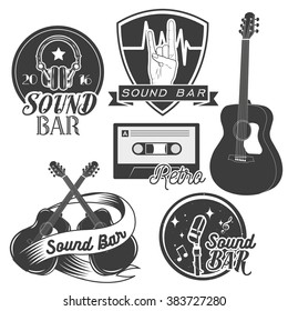 Vector set of sound recording studio labels in vintage style. Rock music instruments, cassette tape, guitar isolated on white background. Design elements, emblems, badges, logo and icons.