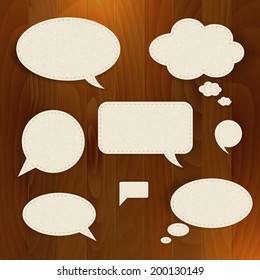Vector set speech paper bubble on wood background. Isolated. 