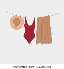 Vector set of summer beachwear drying on a rope after swimming. Isolated on white background