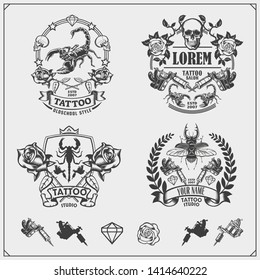 Vector set of tattoo salon labels, badges and design elements. Tattoo studio emblems with professional equipment, scorpion, beetle and skull. Print design for t-shirt.