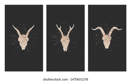 Vector set of three illustrations with gold silhouettes skulls deer, goats and grunge elements on black background. For you design, print, tattoo or magic craft.