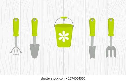 Vector set of tools for gardening. Gardening collection on wood texture. Cartoon style. Background pattern