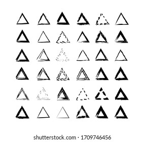 A vector set of traced triangles. Triangles drawn with brushes isolated on a black background