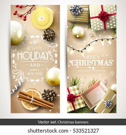 Vector set of two Christmas banners with gold gift boxes, branches and baubles on gold background