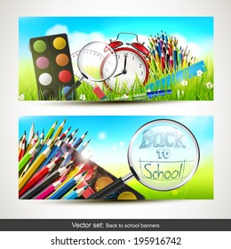 Vector set of two school banners with school supplies in the grass