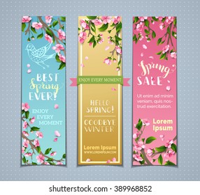 Vector set of vertical spring banners. Pink cherry blossoms, leaves and birds on tree branches. Hello spring! Goodbye winter! Best spring ever! Spring sale. There is place for your text.