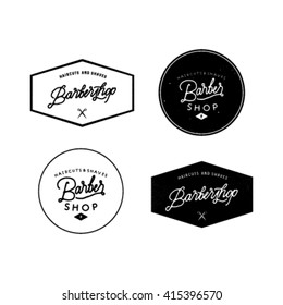 Vector set of vintage barber shop emblems.