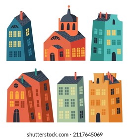 Vector set of vivid isolated buildings. Collection of various houses. Simple irregular shape buildings with tile roofs and chimneys. Doodle graphic. Flat illustrations of lovely multicolor houses