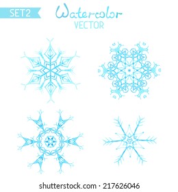 Vector set of watercolour snowflakes. Four various hand-painted snowflakes isolated on white background.