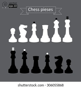 Vector set of white and black chess pieces silhouettes on a gray background