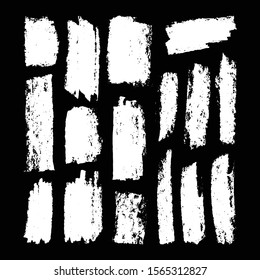 Vector set of white chalk strokes on the black background