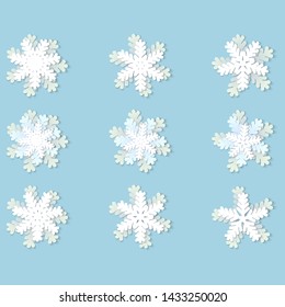 Vector set of white Christmas paper snowflakes with shadow on blue background. Holiday, New year and Christmas design elements