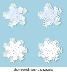 Vector set of white Christmas paper snowflakes with shadow on blue background. Holiday, New year and Christmas design elements