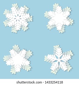 Vector set of white Christmas paper snowflakes with shadow on blue background. Holiday, New year and Christmas design elements