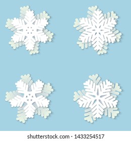 Vector set of white Christmas paper snowflakes with shadow on blue background. Holiday, New year and Christmas design elements