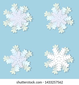 Vector set of white Christmas paper snowflakes with shadow on blue background. Holiday, New year and Christmas design elements