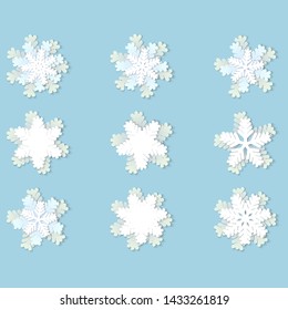 Vector set of white Christmas paper snowflakes with shadow on blue background. Holiday, New year and Christmas design elements