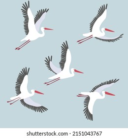 Vector set with white flying cranes on a blue background. Graphic print with sea birds.