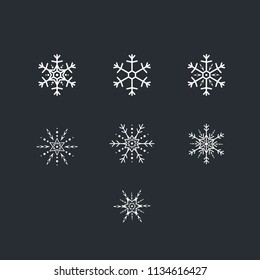 Vector set of white snowflakes. Snowflakes on dark background.  Vector illustration.
