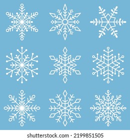 Vector set of white snowflakes on a blue background.