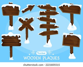 Vector set of wooden pointers and boards for your text in winter style under white snow.  Game resources of shields, a cartoon-style design element.