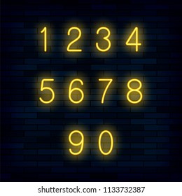 Vector Set of Yellow Neon Numbers Isolated on Dark Brick Background